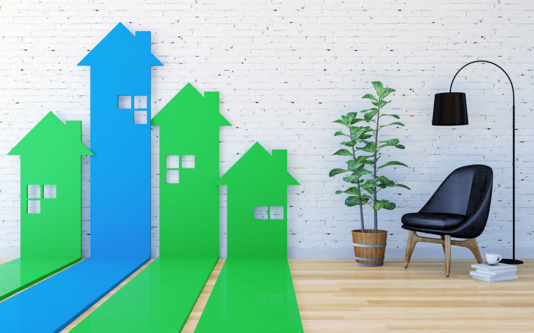 a minimalist space contraining a black chair, floor lam and plant. Blue and Green houses are illustrated on the wall. Real estate investing benefits
