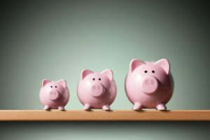 three piggy banks in increasing size - Harrison White Mortgage Broker
